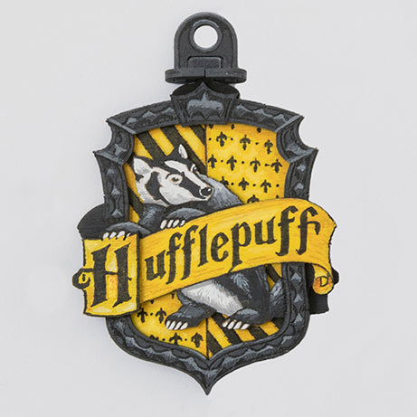 Hufflepuff Harry Potter IncrediBuilds Emblematics kit featuring stationery and collectible elements from Insight Editions.