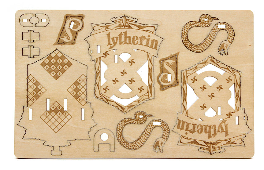 Harry Potter Slytherin IncrediBuilds Emblematics kit with stationery and collectible components from Insight Editions.
