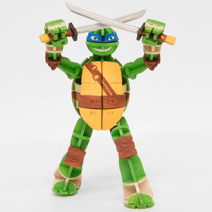 IncrediBuilds Teenage Mutant Ninja Turtles Leonardo 3D wood model kit, featuring detailed parts for assembling the iconic turtle.