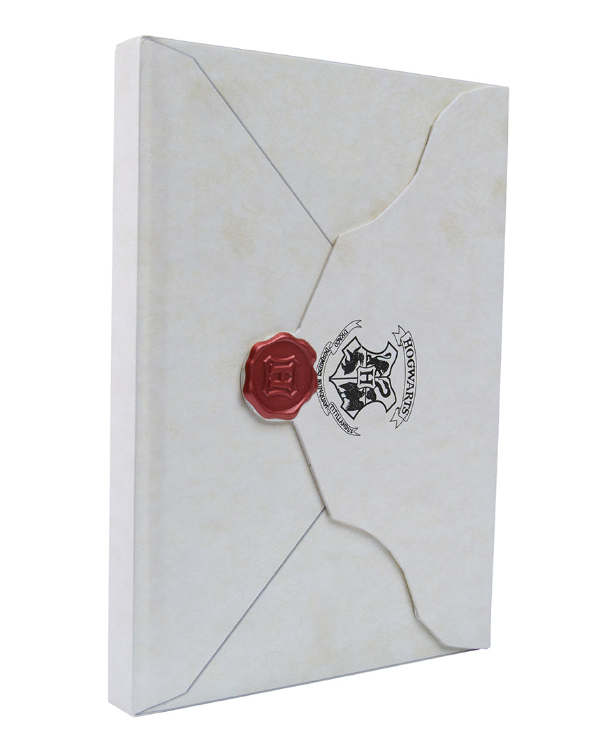 Hardbound Harry Potter Hogwarts Acceptance Letter journal with a matching wand pen set by Insight Editions