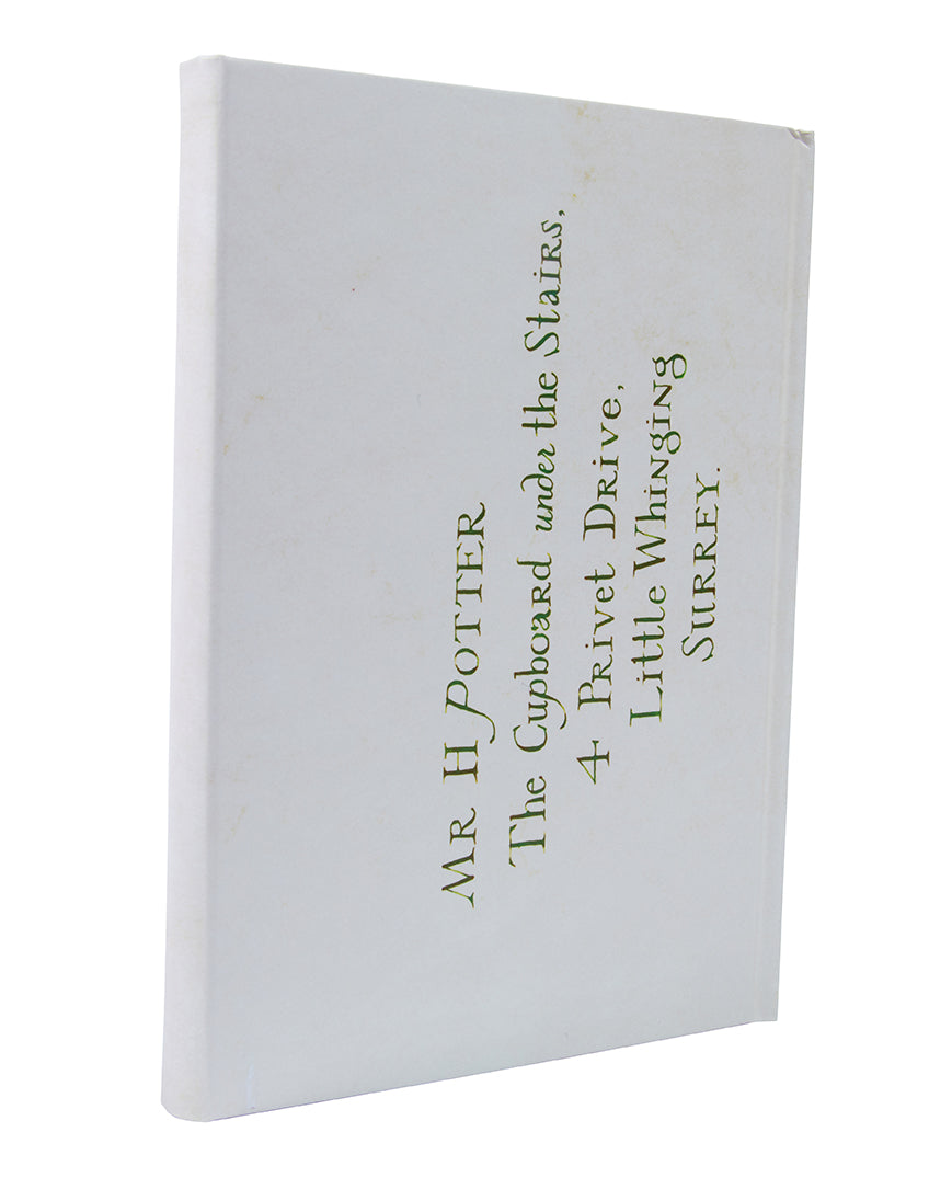 Hardbound Harry Potter Hogwarts Acceptance Letter journal with a wand-shaped pen from Insight Editions, perfect for magical note-taking.