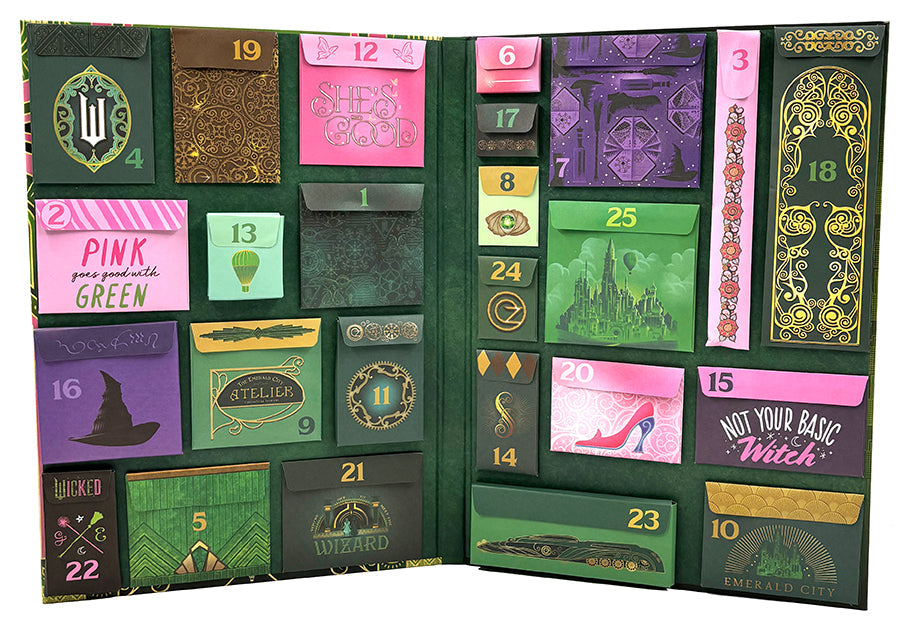 Inside view of Wicked: The Official Advent Calendar kit, a hardbound edition by Insight Editions, featuring festive pages and themed artwork.