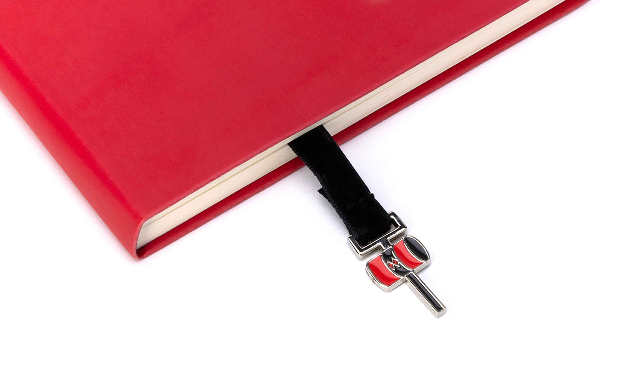 Softcover DC Harley Quinn journal with ribbon charm by Insight Editions, featuring colorful Harley Quinn artwork and decorative cover.