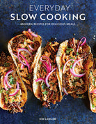 Softcover copy of "Everyday Slow Cooking" cookbook by Insight Editions, featuring a cozy kitchen scene on the cover.