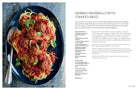 Softcover copy of "Everyday Slow Cooking" cookbook by Insight Editions, featuring a cozy kitchen scene with prepared dishes.