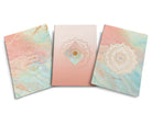 Set of three softcover Gratitude Sewn Notebooks from Insight Editions with embossed covers and lined pages for journaling.