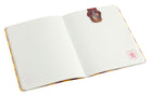 Inside view of a Harry Potter Gryffindor notebook and page clip set, with softcover cover and gold foil accents, branded by Insight Editions.