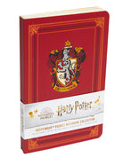 Set of three softcover Harry Potter Gryffindor pocket notebooks from Insight Editions, featuring house crest designs.