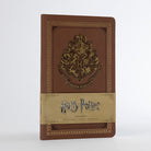 Softcover Harry Potter Hogwarts ruled notebook by Insight Editions with enchanted design on the cover.