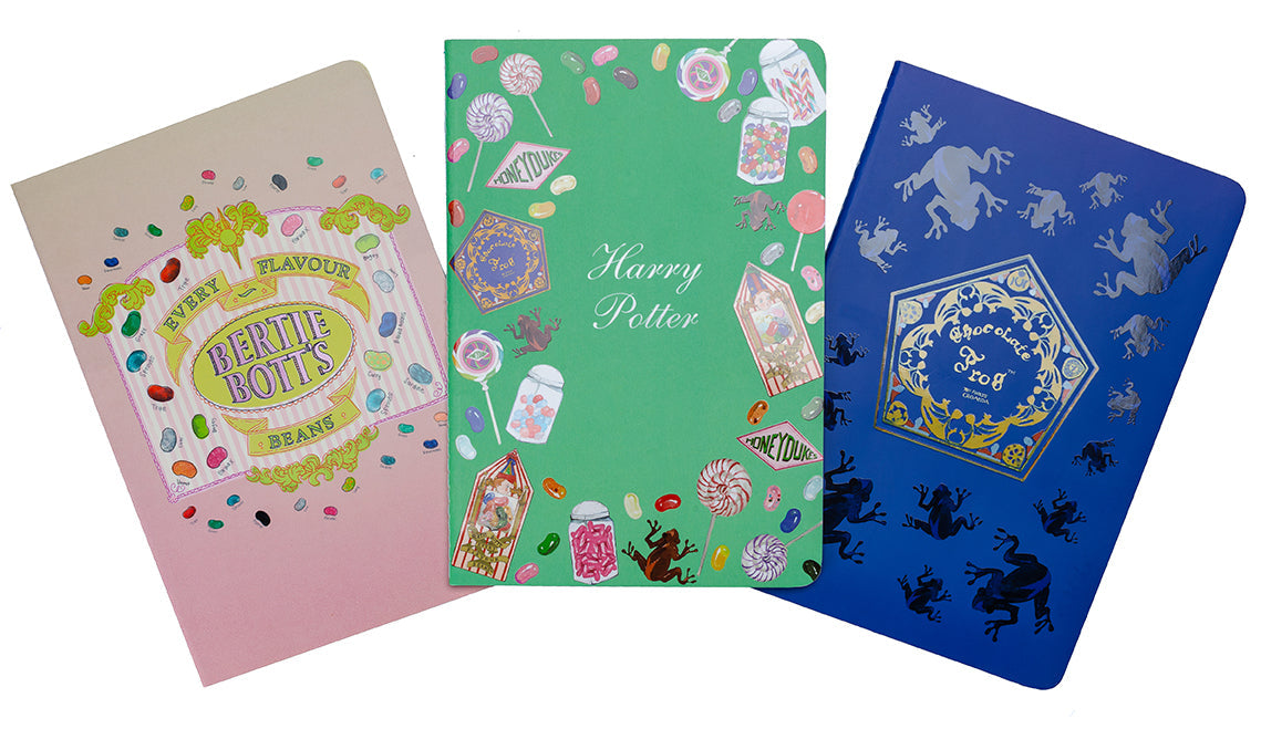 Set of three Harry Potter Honeydukes softcover planner notebooks from Insight Editions featuring magical designs and themed pages.