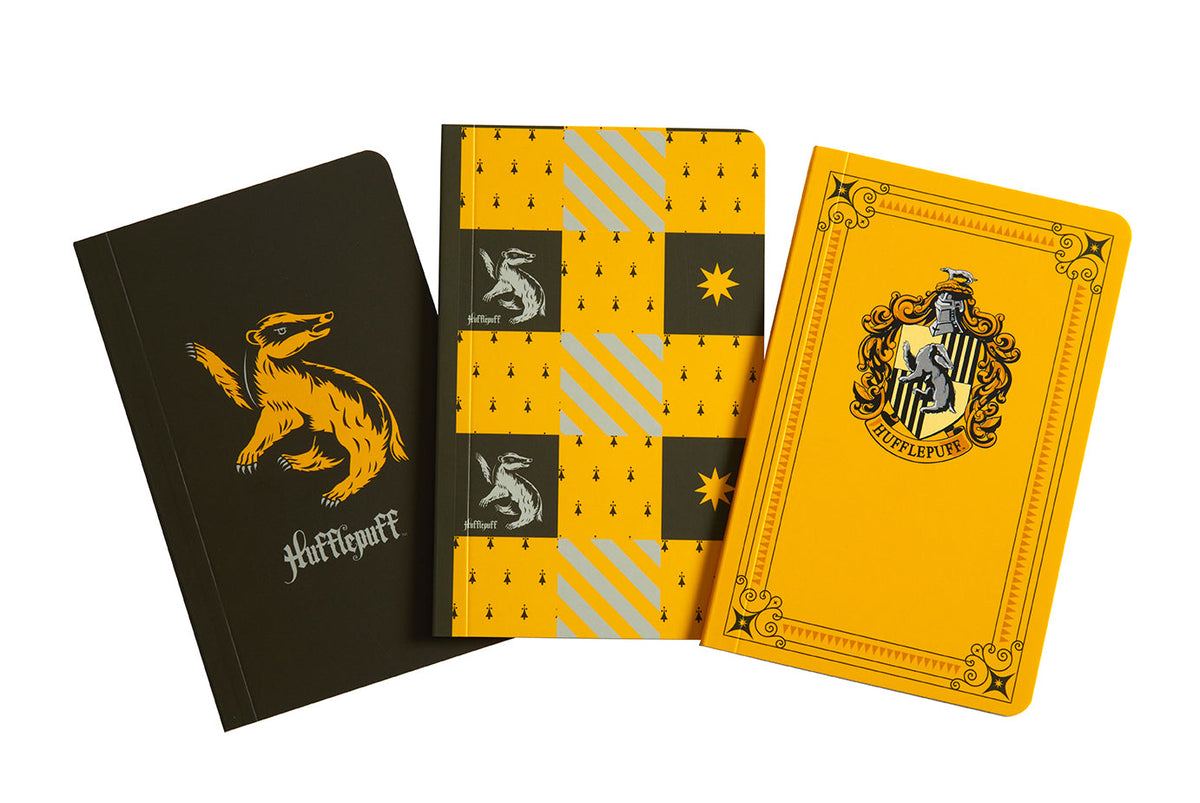 Set of three Harry Potter Hufflepuff softcover pocket notebooks from Insight Editions, featuring colorful covers and Hufflepuff house symbols.