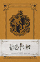 Softcover Harry Potter Hufflepuff ruled notebook by Insight Editions featuring the Hufflepuff house emblem and design.