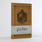 Softcover Harry Potter Hufflepuff ruled notebook by Insight Editions featuring Hufflepuff crest and yellow cover design.