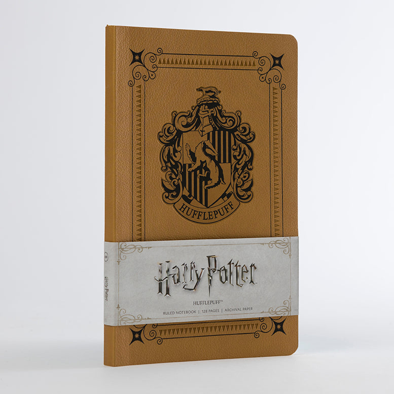 Softcover Harry Potter Hufflepuff ruled notebook by Insight Editions featuring Hufflepuff crest and yellow cover design.