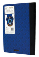 Inside of Harry Potter Ravenclaw Notebook with lined pages and a Ravenclaw-themed page clip, softcover journal by Insight Editions.