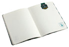 Slytherin notebook and page clip set from Harry Potter by Insight Editions, softcover with green Slytherin emblem and decorative clips.