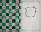 Softcover Harry Potter Slytherin ruled notebook by Insight Editions featuring Slytherin house emblem and green design.