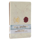Set of three softcover Harry Potter Welcome to Hogwarts planner notebooks by Insight Editions with magical-themed covers.