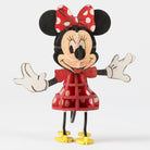 Softcover Disney Minnie Mouse book and 3D wood model by IncrediBuilds, featuring colorful illustration and detailed craft design.