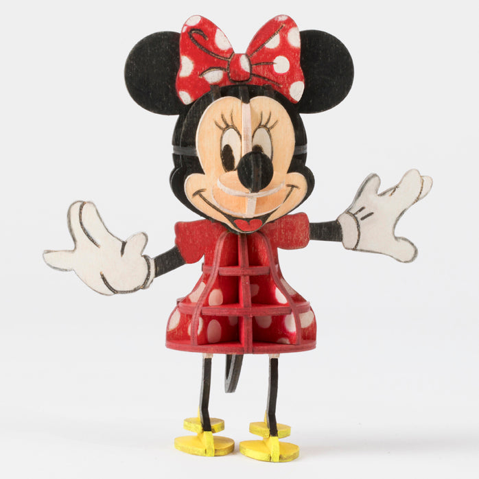 Softcover Disney Minnie Mouse book and 3D wood model by IncrediBuilds, featuring colorful illustration and detailed craft design.