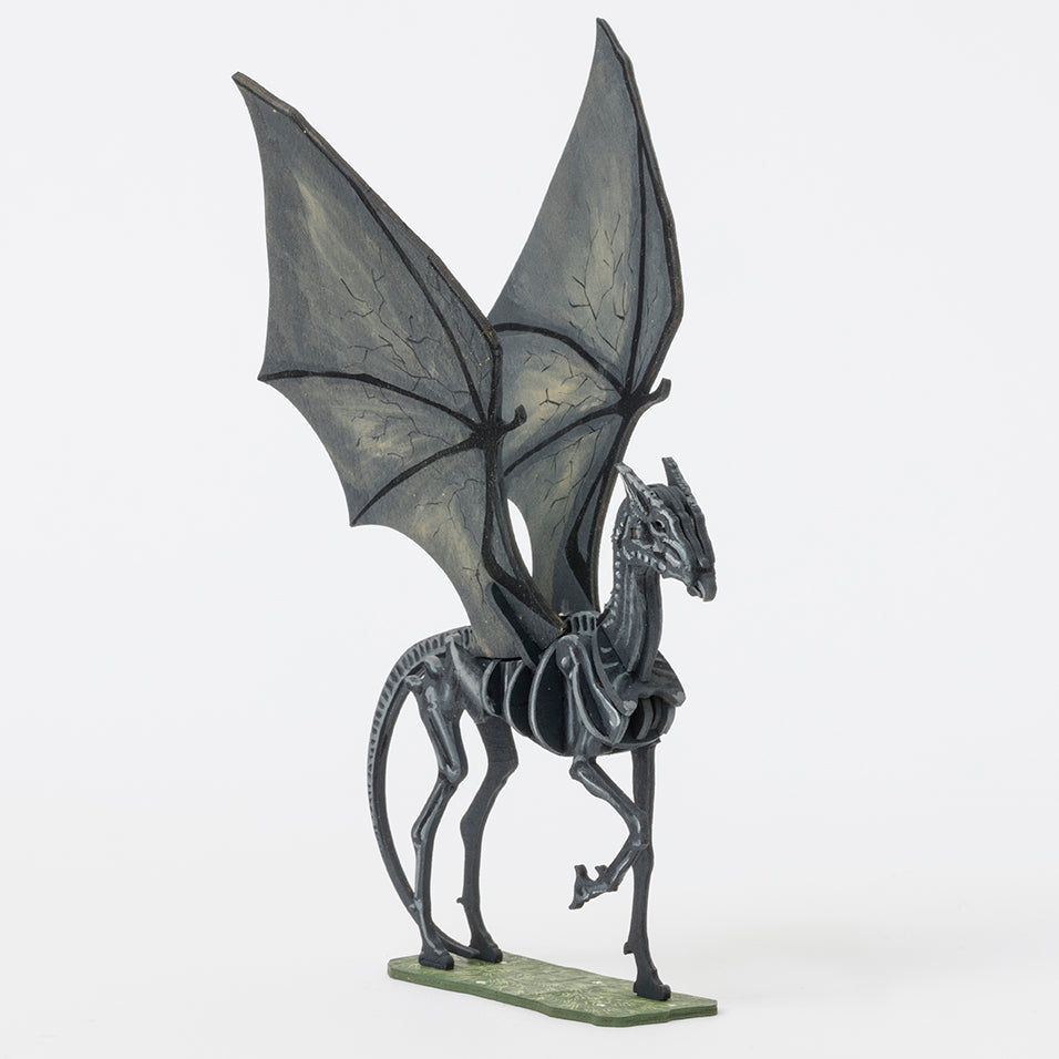 Softcover Harry Potter Thestral 3D wood model and book by IncrediBuilds, featuring detailed illustrations and assembled model.