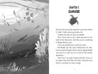 Softcover copy of "Mystery at the Aquarium" by Insight Editions featuring colorful aquarium scene on the cover.