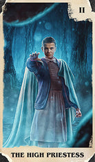 Inside view of the Stranger Things Tarot Deck and Guidebook by Insight Editions, featuring illustrated tarot cards and instructional pages.