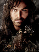 Open softcover copy of The Hobbit book by Insight Editions with detailed interior illustrations visible.