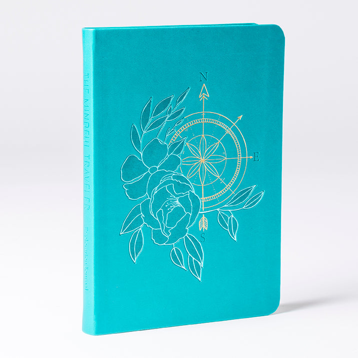 Softcover book titled The Mindful Traveler by Insight Editions, featuring a serene cover image suitable for mindfulness and travel.