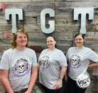 Lilac short sleeve graphic tee from The Graphic Tee featuring the phrase "It's Hard to Be A Diamond in A Rhinestone World" on a stylish design.