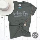 Heather military green short sleeve graphic tee featuring "It's Not Hoarding If It's Plants" motto from The Graphic Tee.