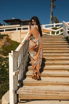 Hera Caftan by Jennafer Grace, handmade bohemian-style dress with intricate patterns and flowing fabric.