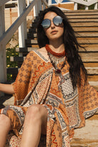 Handmade Hera Caftan by Jennafer Grace featuring flowing fabric and intricate details in a vibrant, elegant design.