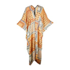 Jennafer Grace Hera Caftan in vibrant fabric, featuring flowing design and elegant draping, perfect for stylish everyday wear.
