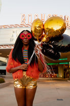 Jennafer Grace Planet Queen orange faux fur jacket on a girl, showcasing the plush, vibrant fur with a stylish fit.