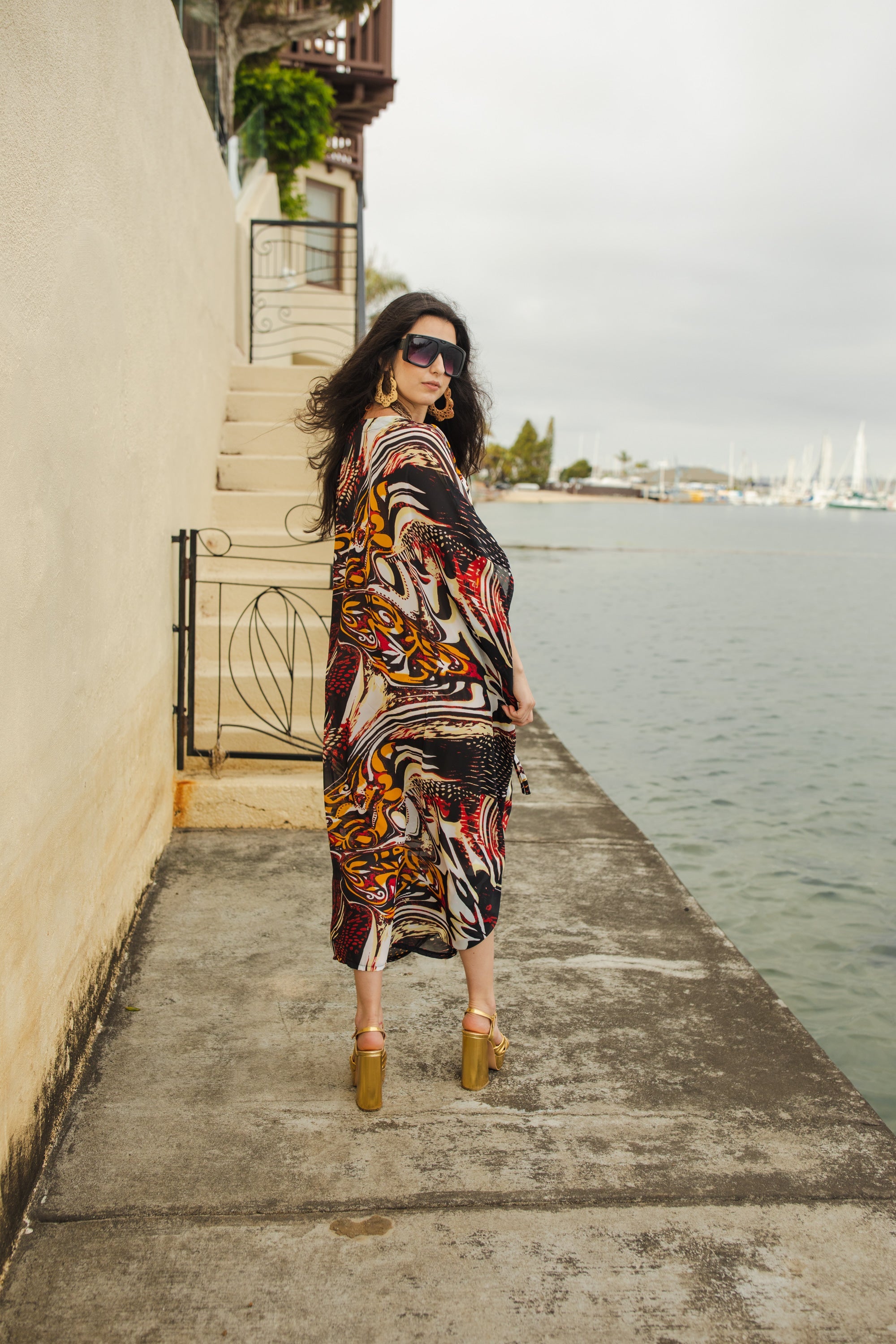 Handmade Jennafer Grace Actius Caftan in vibrant rouge, flowing kaftan dress with intricate details and elegant design.