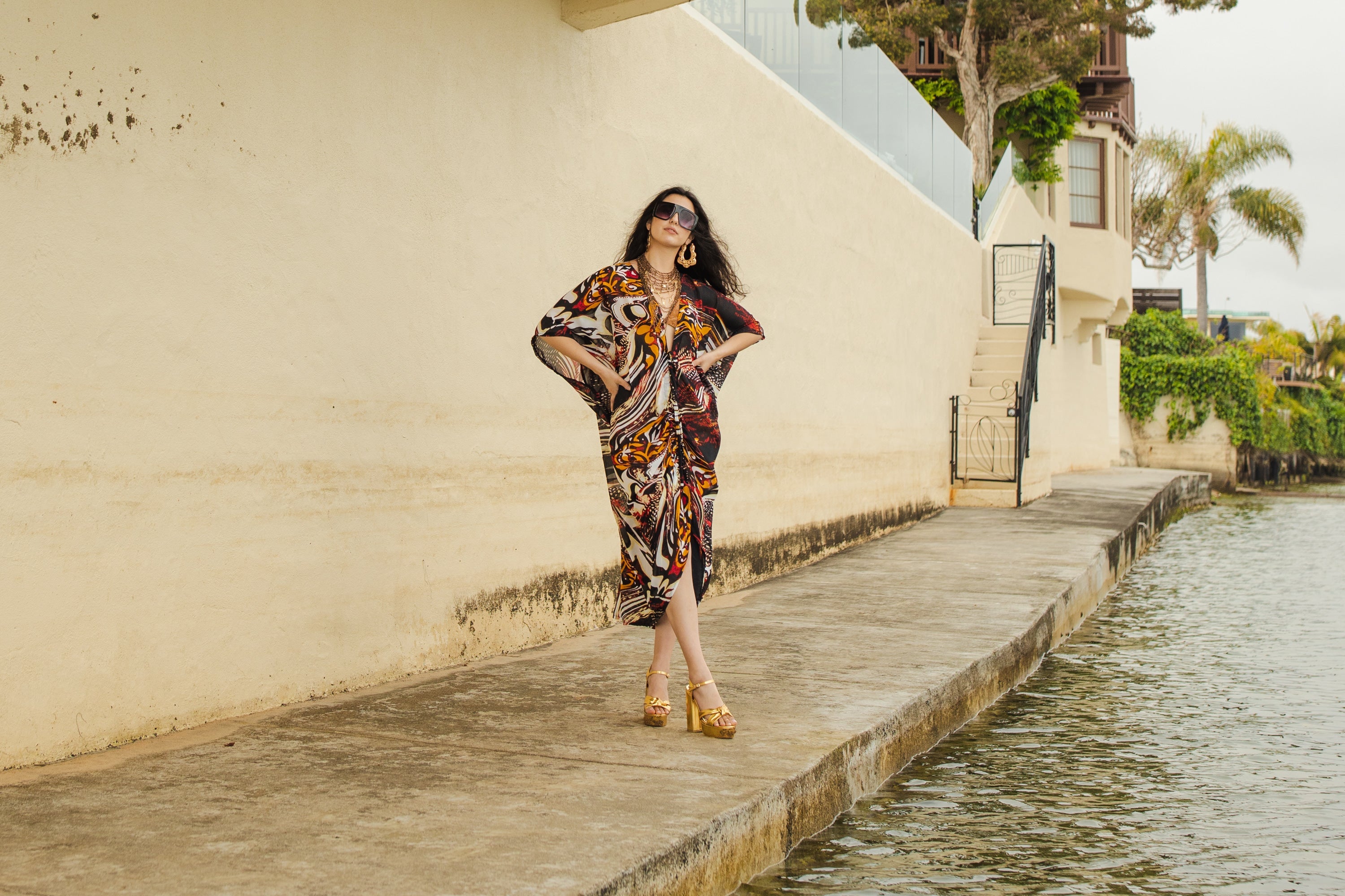 Handmade Jennafer Grace Actius Caftan in vibrant rouge, featuring flowing fabric and intricate design for elegant wear.