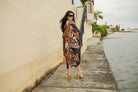 Handmade Jennafer Grace Actius Kaftan Dress in vibrant rouge with flowing fabric and intricate details.