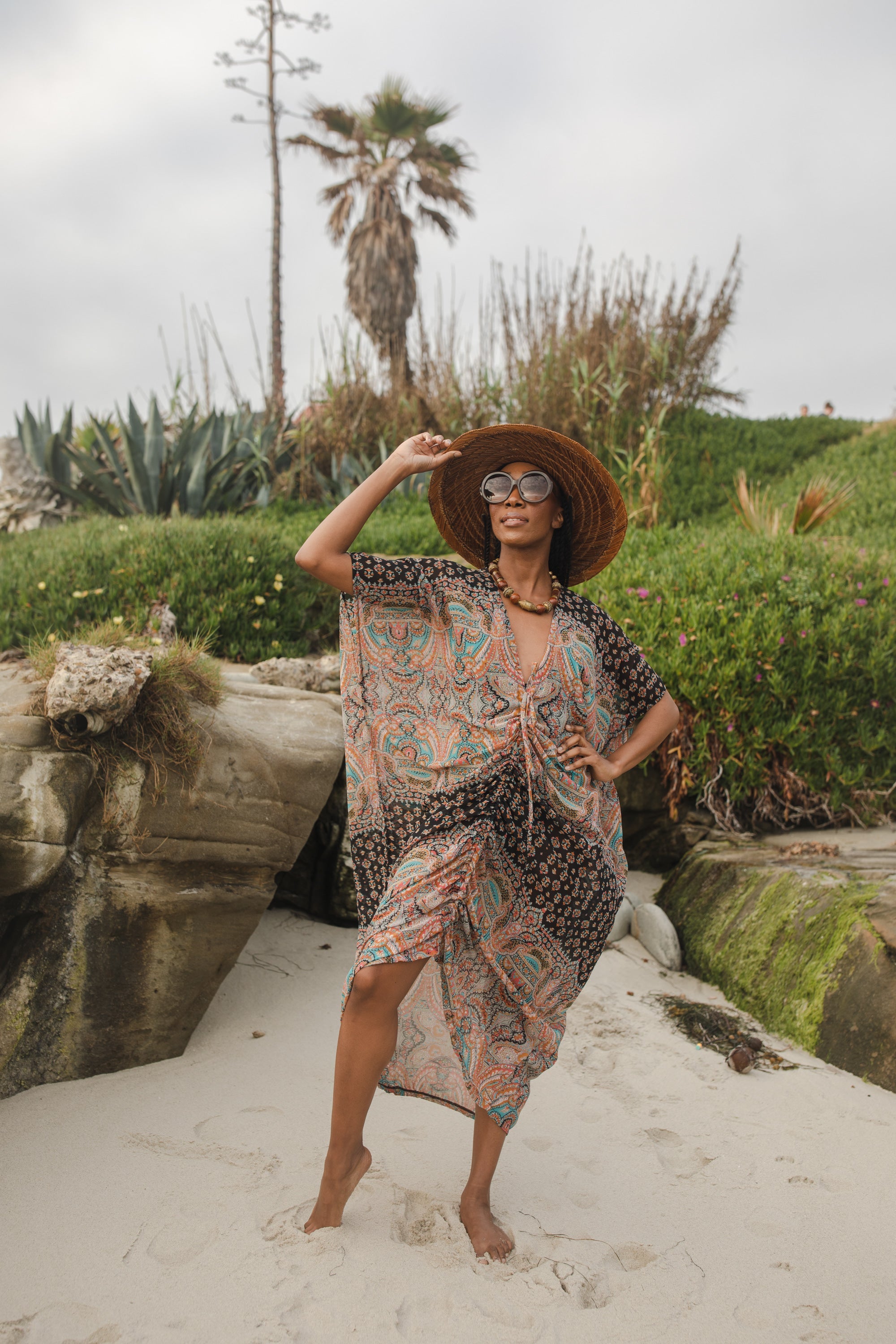 Jennafer Grace Actius Caftan in Taj, elegant bohemian-style kaftan dress with intricate patterns and flowing fabric.