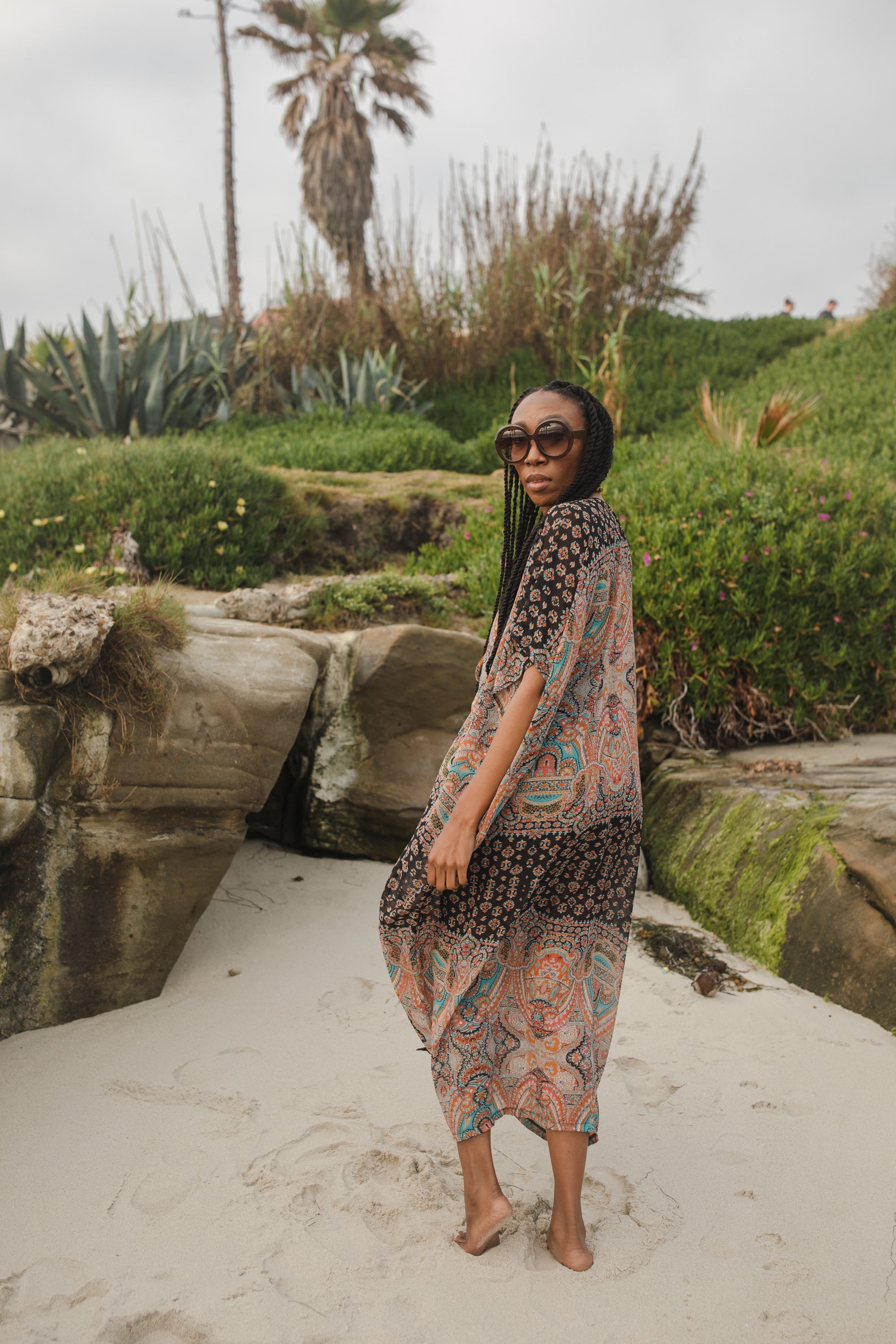 Jennafer Grace Actius Caftan in Taj featuring flowing fabric and intricate pattern, perfect for elegant summer wear.