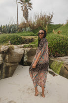 Jennafer Grace Actius Caftan in Taj featuring flowing fabric and intricate pattern, perfect for elegant summer wear.