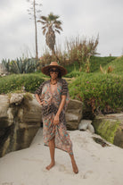 Jennafer Grace Actius Caftan in Taj, elegant long kaftan dress with intricate patterns and flowing fabric.