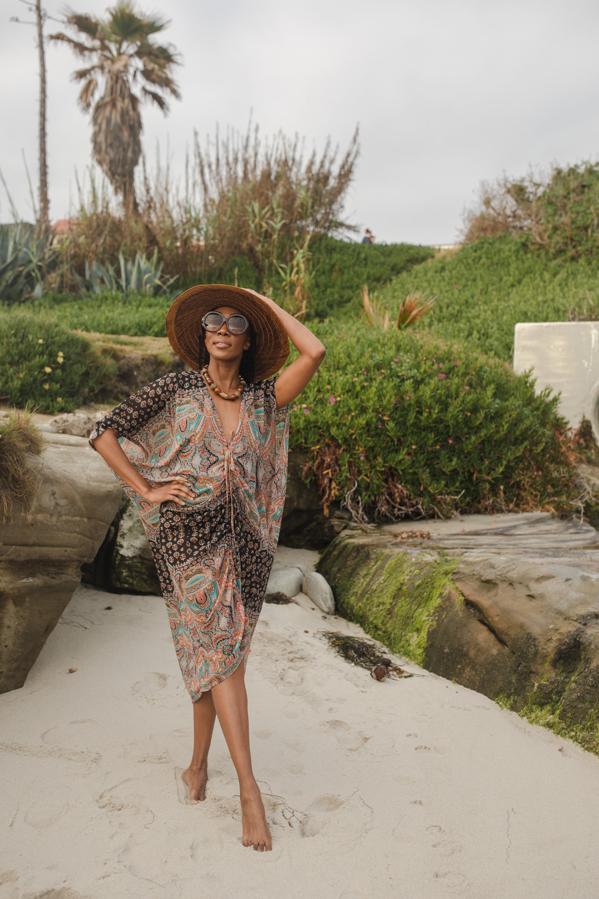 Jennafer Grace Actius Caftan in Taj, elegant long kaftan dress with intricate patterns, flowing fabric and detailed embroidery.