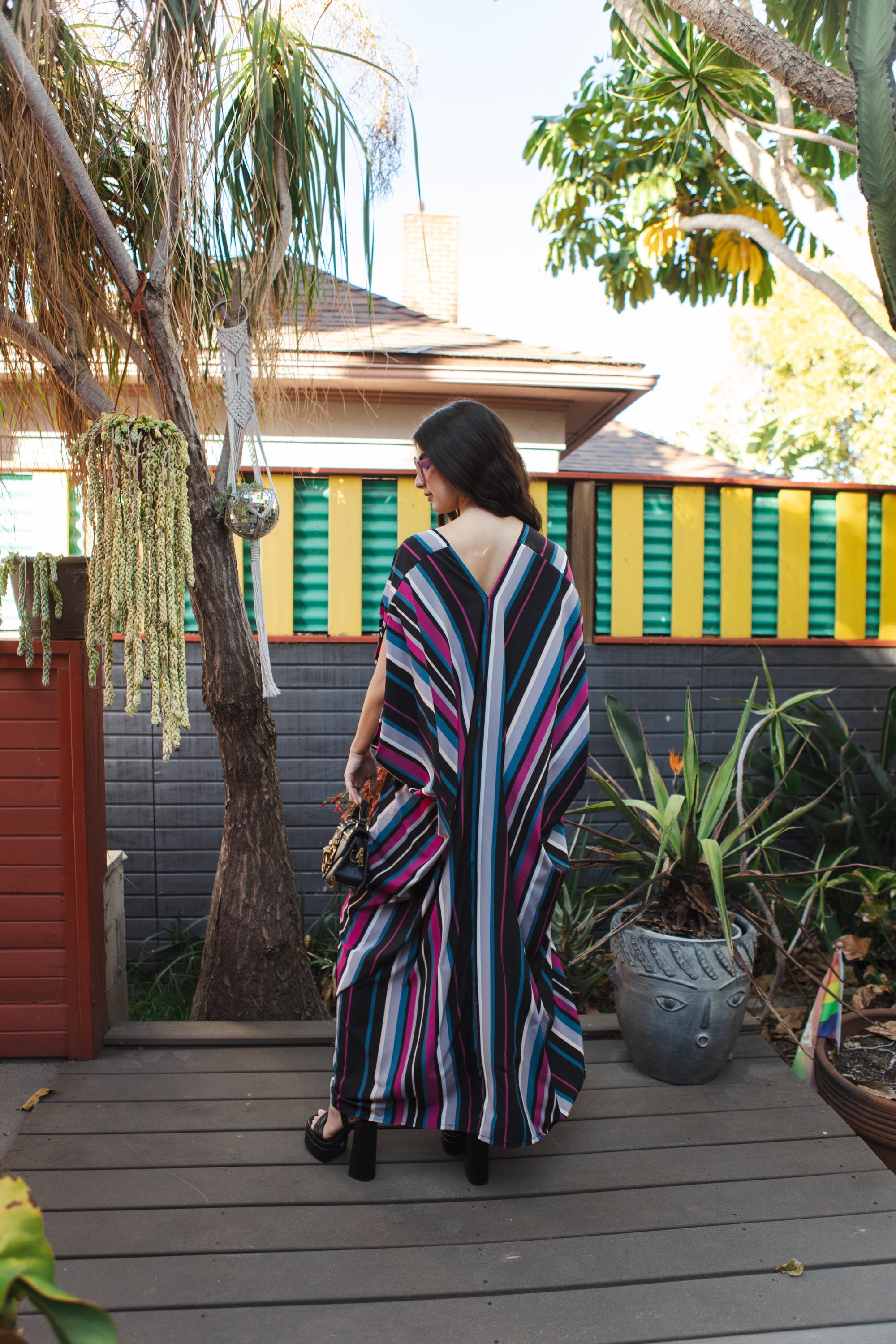 Handmade Raspberry Stripe Kaftan Dress by Jennafer Grace with flowing fabric and vibrant stripe pattern.