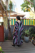 Handmade Raspberry Stripe Kaftan Dress by Jennafer Grace with flowing fabric and vibrant stripe pattern.