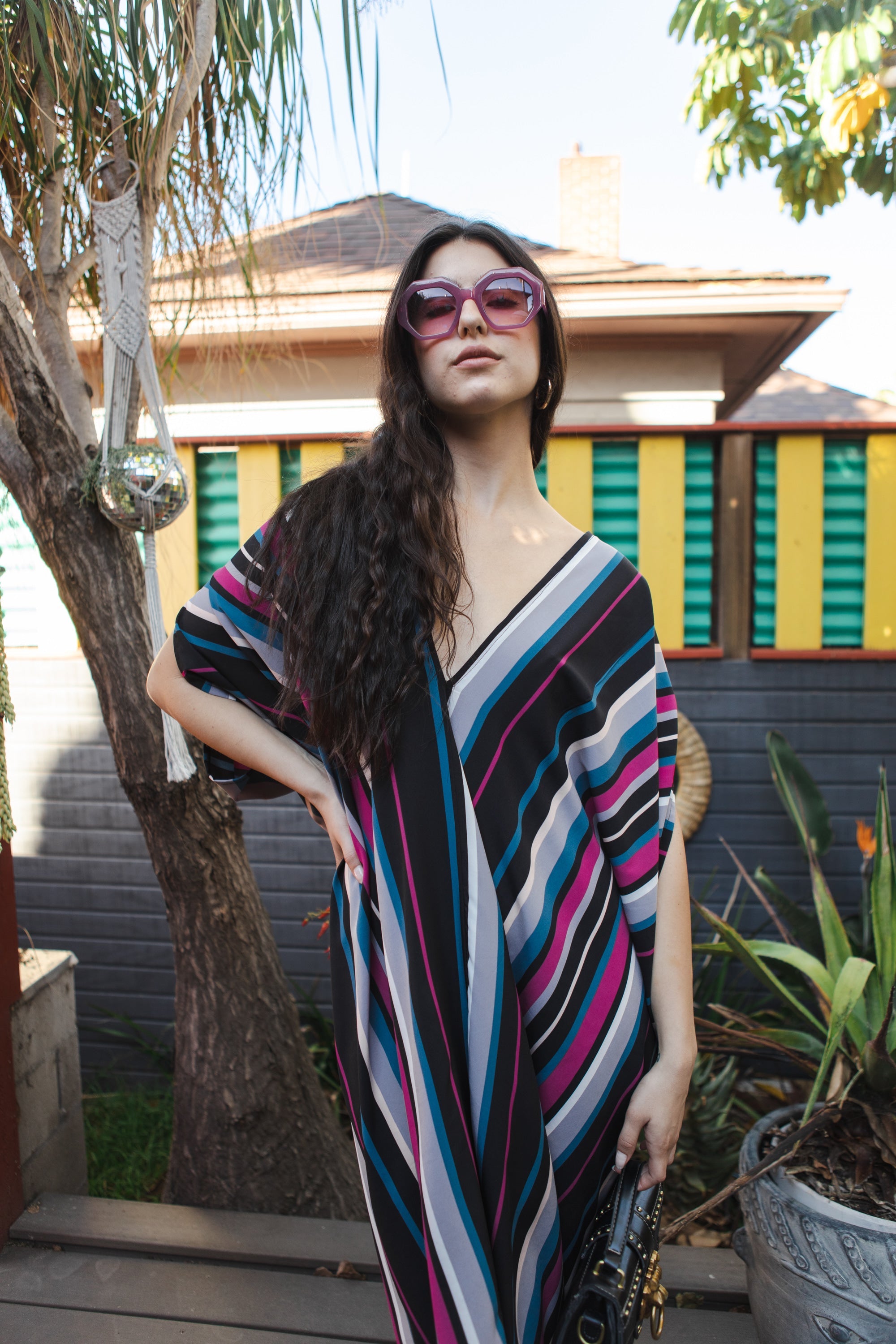 Handmade Raspberry Stripe Kaftan dress by Jennafer Grace featuring vibrant red and white stripes and flowing fabric.