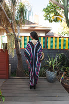 Raspberry stripe kaftan dress by Jennafer Grace featuring flowing fabric and vibrant pattern, hand-made style.