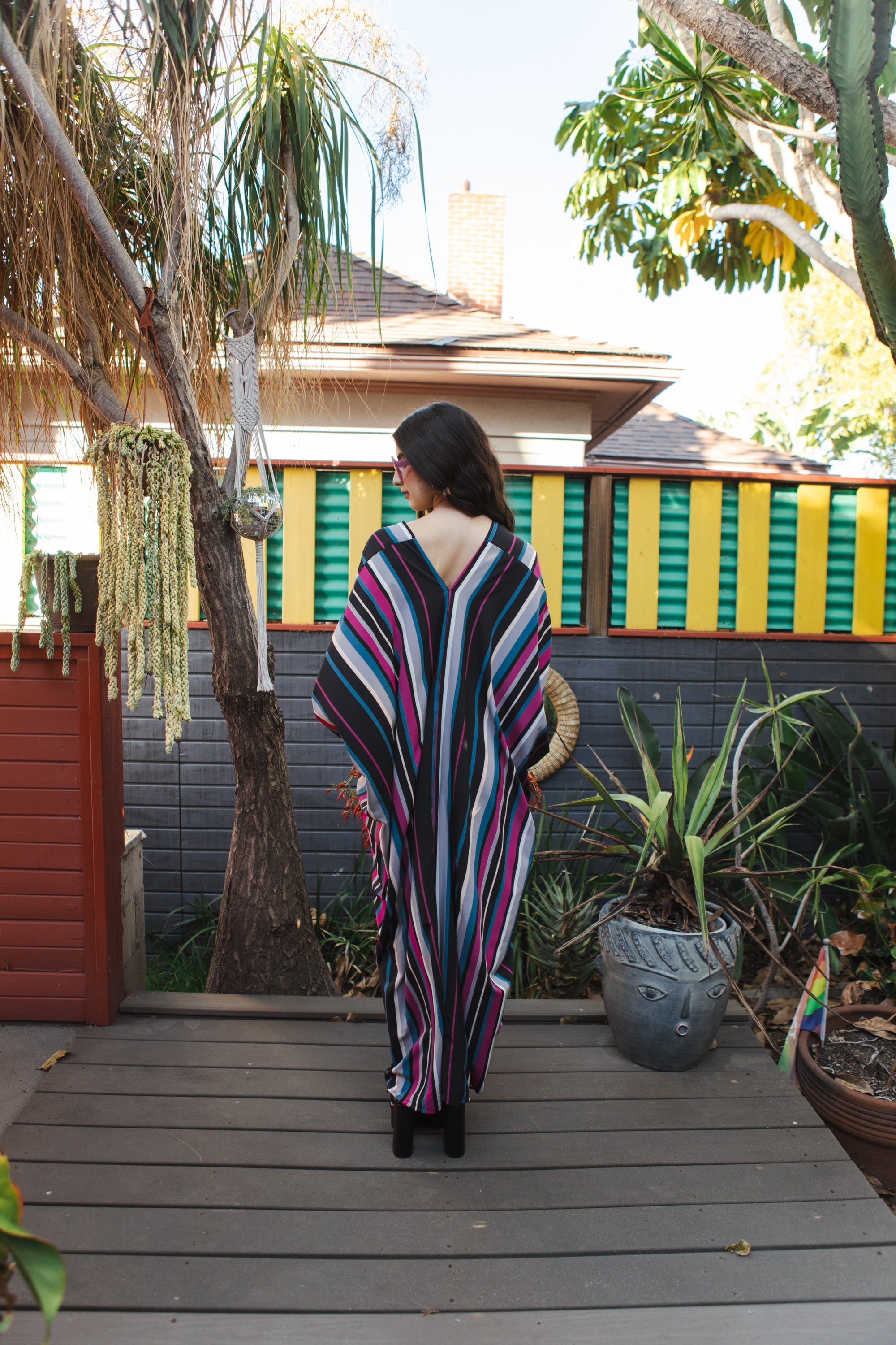 Raspberry stripe kaftan dress by Jennafer Grace featuring flowing fabric and vibrant pattern, hand-made style.