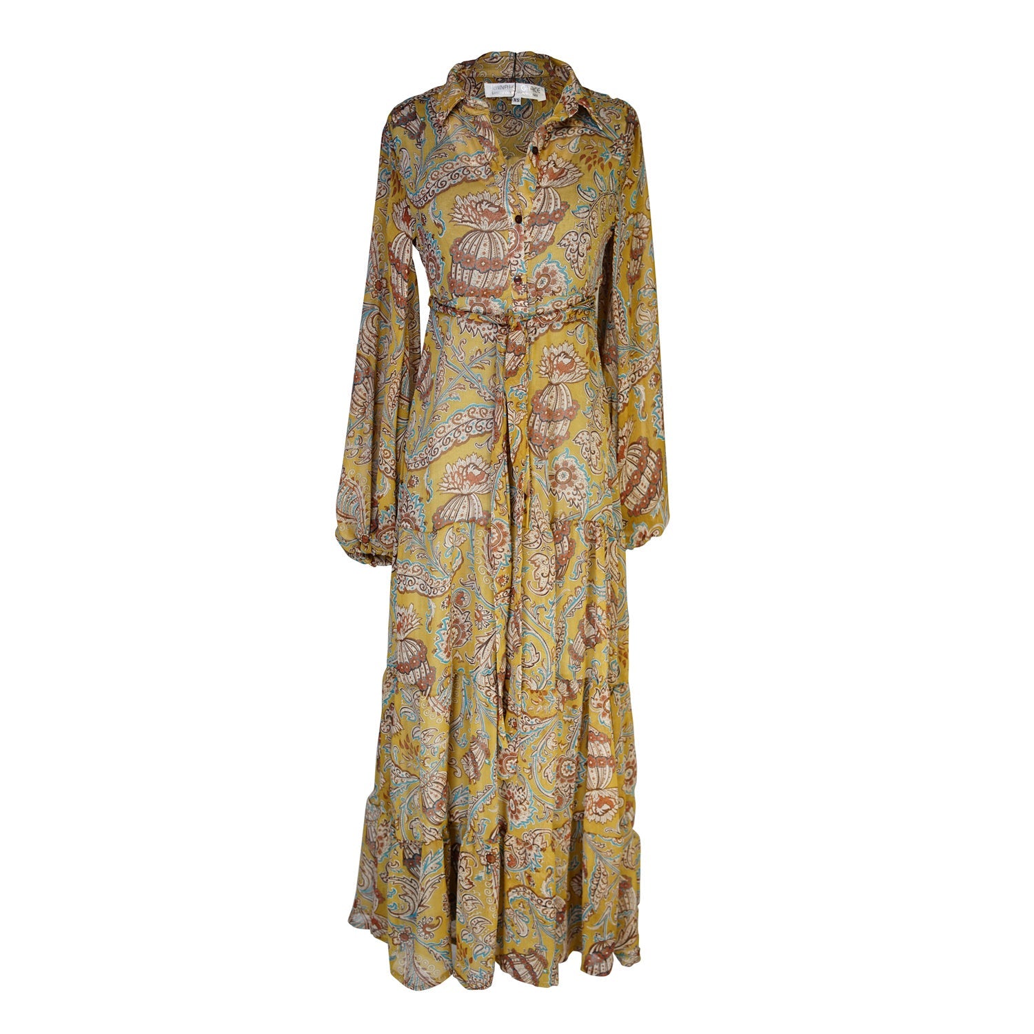 Jennafer Grace Agnes Bookie Maxi Dress laid flat, featuring a flowy, ankle-length design with elegant fabric and subtle pattern details.
