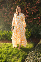 Jennafer Grace Amarillo Love Maxi Dress featuring a flowy yellow fabric and sleeveless design, perfect for summer occasions.